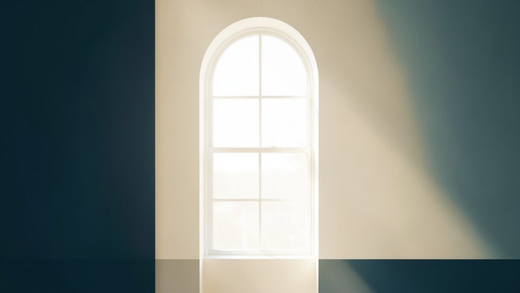 A tall arched window with daylight streaming through, suggesting a bounded field of view.