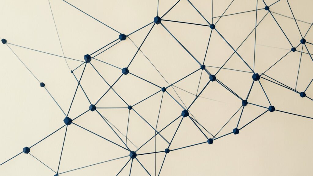 A network of geometric nodes with thin connecting lines forming a constellation.
